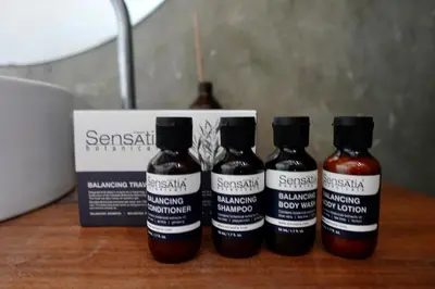 three bottles of sauce sitting on a table next to a box at Spacious Family Home & Office Canggu, stay with cats in Canggu