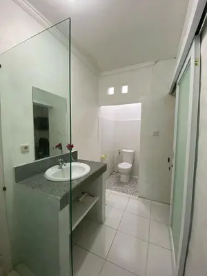 a bathroom with a sink and a toilet at Cozy room Kuta - 1 minutes to the beach by Micky Studio2 in Legian