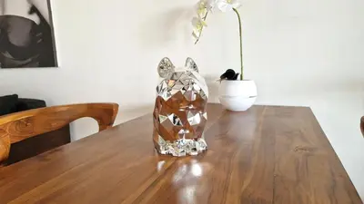 a vase sitting on top of a wooden table at Nice Place To Stay - Rooftop Apartments in Seminyak