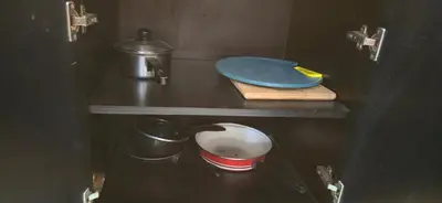 a kitchen counter with two pots and pans on it at The Palmana Tropical Roofline Jayakarta Residence 40 in Badung