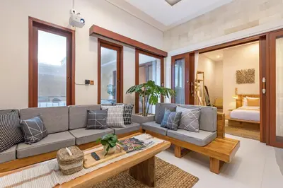 a living room with a couch and a table at Villa Lavinia - Private Pool Villa - Seminyak Kuta - Double Six Beach in Seminyak