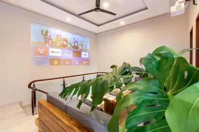 a living room with a couch and a plant at Villa Lavinia - Private Pool Villa - Seminyak Kuta - Double Six Beach in Seminyak