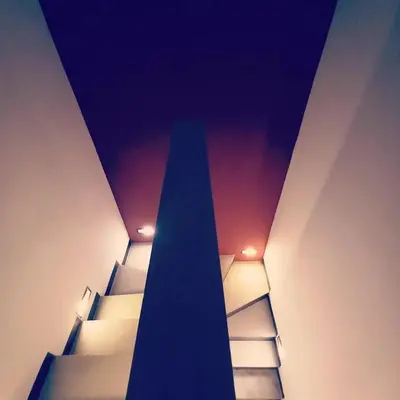 a staircase in a room with lights on the ceiling at PalmA Private Villa - A Leafy Place in Mumbul Hill in Nusa Dua
