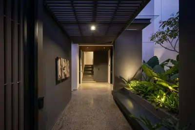 a hallway of a house with a hallway at Marvee Suites Bali in Canggu
