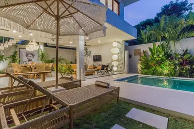 a house with a swimming pool and a patio at Villa Jazz 3BR 10m Pool seminyak in Seminyak