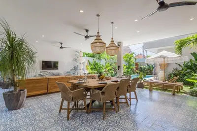 a dining room with a table and chairs at Villa Jazz 3BR 10m Pool seminyak in Seminyak