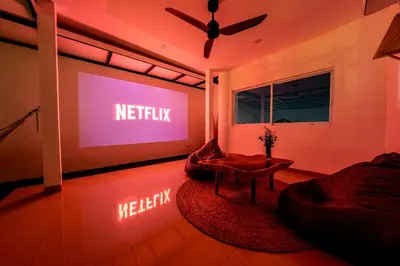 a living room with a large screen with the words netflix at Proart 2 - Your Bali Home Away from Home - Roomy, Scenic, Relaxing in Nusa Dua