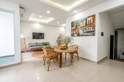 a living room with a table and a couch at Proart 2 - Your Bali Home Away from Home - Roomy, Scenic, Relaxing in Nusa Dua