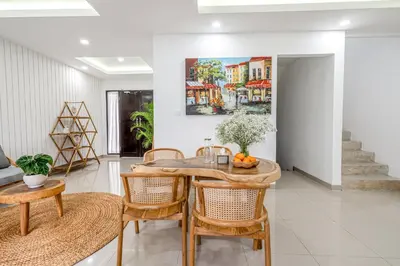 a dining room with a table and chairs at Proart 2 - Your Bali Home Away from Home - Roomy, Scenic, Relaxing in Nusa Dua