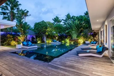 a swimming pool in the middle of a house at Bali paradise Rosa in Seminyak