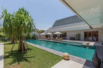 a swimming pool in the backyard of a house at Villa Jinjah Soul Luxury 5BR Villa,18m Pool & Garden in Seminyak
