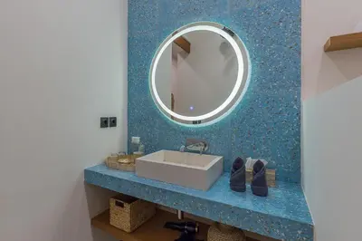a bathroom with a sink and a mirror at Villa Pop Cozy 2BR Villa & Pool Seminyak in Seminyak