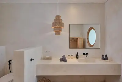 a bathroom with a sink and a mirror at Villa Bali Manis by The Bali Agent - Central Seminyak 4BR Villa with Private Pool, Perfect for Families & Groups in Seminyak