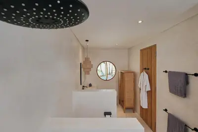a bathroom with a white tub and a sink at Villa Bali Manis by The Bali Agent - Central Seminyak 4BR Villa with Private Pool, Perfect for Families & Groups in Seminyak