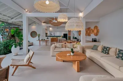 a living room with white furniture and a table at Villa Bali Manis by The Bali Agent - Central Seminyak 4BR Villa with Private Pool, Perfect for Families & Groups in Seminyak
