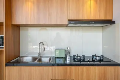 a kitchen with a sink and a stove at Sunterra 2 - Bali Villa Dream with Huge Pool in Kerobokan