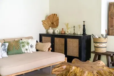 a living room with a couch and a table at 3BR Green Oasis downtown Berawa Canggu in Canggu