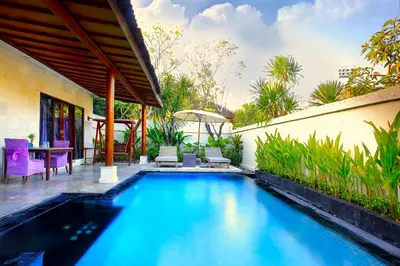 a swimming pool in the backyard of a house at Private Pool Villas Kuta Bali in Badung