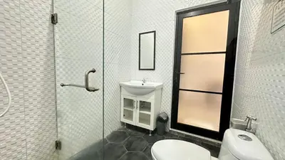 a bathroom with a toilet and a sink and a shower at 2 Bedrooms Villa Petitenget Private Pool in Seminyak
