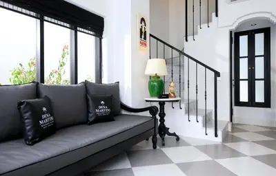 a living room with a couch and a table at Martini Beachside Villa 5 in Canggu