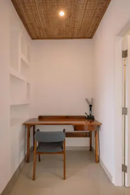 an office with a wooden desk and a chair at Villa Batu Putih 3 Seminyak in Seminyak
