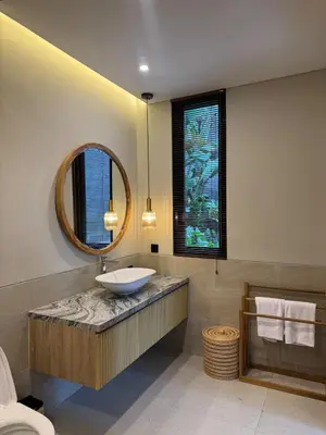 a bathroom with a sink and a mirror at Family Haven 6BR Luxe Villa in Berawa, Canggu in Canggu
