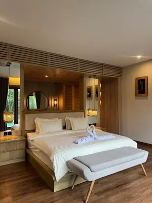 a bedroom with a large bed with a towel on it at Family Haven 6BR Luxe Villa in Berawa, Canggu in Canggu