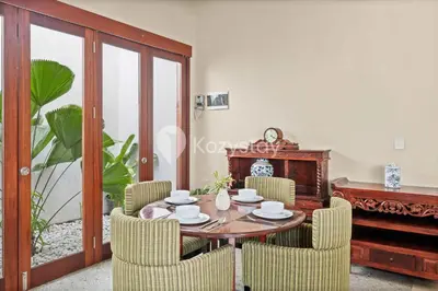 a dining room with a table and chairs at Andrew Villa by Kozystay - Umalas in Canggu
