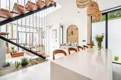 a kitchen and dining room with a table and chairs at Casa Nalani in Bali in Kerobokan