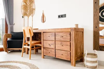 a bedroom with a wooden desk and a chair at Brand new - spacious complex Villas Virland - center Seminyak in Seminyak