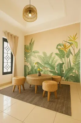a room with a table and two chairs and a mural at Villa Cempaka - Pemogan in Denpasar