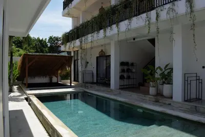a swimming pool in the courtyard of a house at ChinGiack Apartments Canggu Pool and Terrace in Canggu