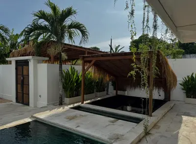 a swimming pool in the backyard of a house at ChinGiack Apartments Canggu Pool and Terrace in Canggu