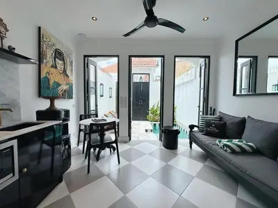 a living room with a couch and a table at Martini Beachside Villa 7 in Canggu