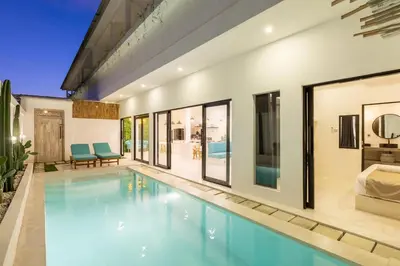 an image of a swimming pool in a house at Aaryan Villa 1 in Seminyak