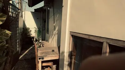 a wooden bench next to a building with a fireplace at kerobokan cozy house by kenta in Seminyak