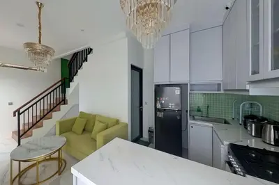 a kitchen with a couch and a table in a room at Villa 9 in Seminyak