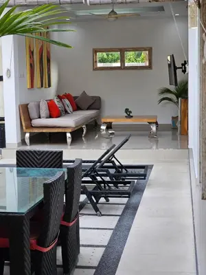 a living room with a couch and a table at Villa Ohana 2 BR Family villa with pool in Umalas in Kerobokan