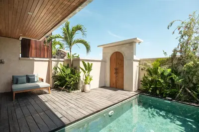 a backyard with a swimming pool and a house at Ben's Villa 1 by Alfred in Bali in Kerobokan