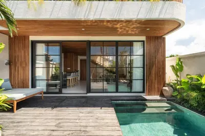 a house with a swimming pool in a yard at Ben's Villa 2 by Alfred in Bali in Kerobokan