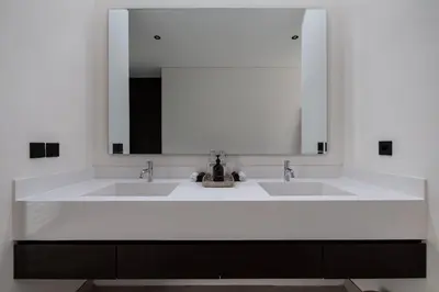 a bathroom with two sinks and a large mirror at Villa Gendang in Seminyak