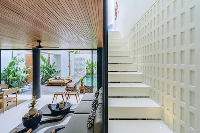 a staircase leading to the living room of a house at Casa Ipanema, Luxury 2 Bedrooms Villa with Cinema in Private Quiet Area in Canggu