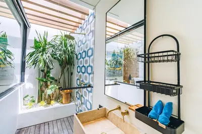 a bathroom with a sink and a window at Casa Ipanema, Luxury 2 Bedrooms Villa with Cinema in Private Quiet Area in Canggu