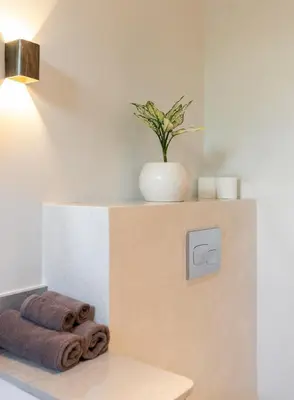 a vase on top of a box with towels at Stylish 2 bedroom Villa in Prime Location in Canggu