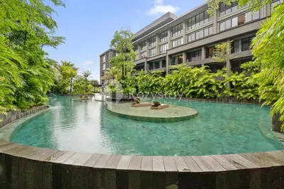 a swimming pool in the middle of a building at Alva by Kozystay - Nusa Dua in Nusa Dua