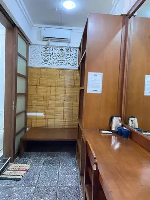 a locker room with a wooden counter and a desk at W Hotel at Kuta Beach By Micky Studio -1 minutes to beach in Legian