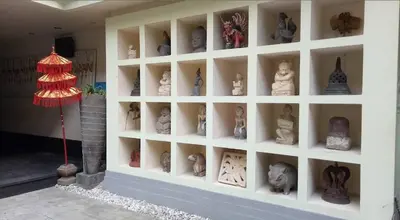 a display case with vases and vases on a wall at W Hotel at Kuta Beach By Micky Studio -1 minutes to beach in Legian
