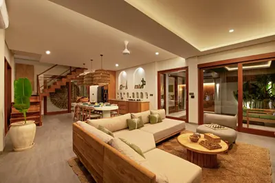 a living room with a couch and a table at Levan Villa Seminyak in Seminyak