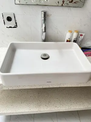 a white sink on a counter in a bathroom at Phil's Harmony Seminyak in Kerobokan