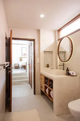 a bathroom with a sink and a mirror at Villa Mai Mai Seminyak in Seminyak